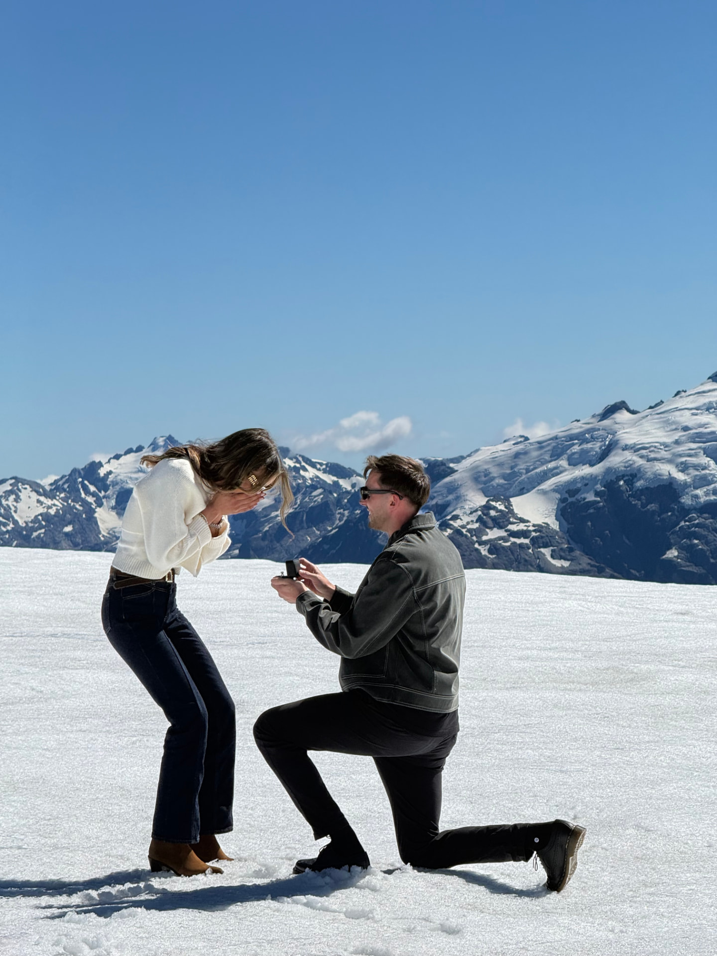 Ché proposing to Elyse on a snowy mountain top